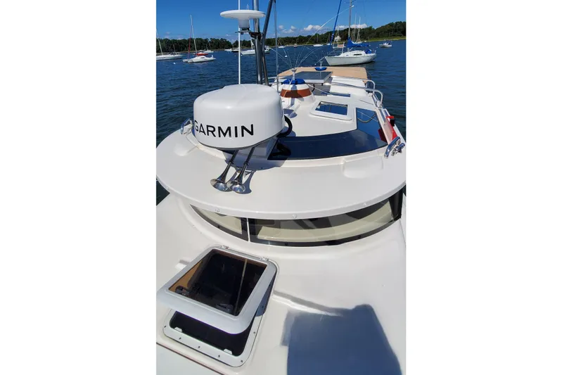 Tusen Takk Yacht Photos Pics 2024 Ranger Tugs R-27 boat with Garmin radar, docked in a scenic marina.