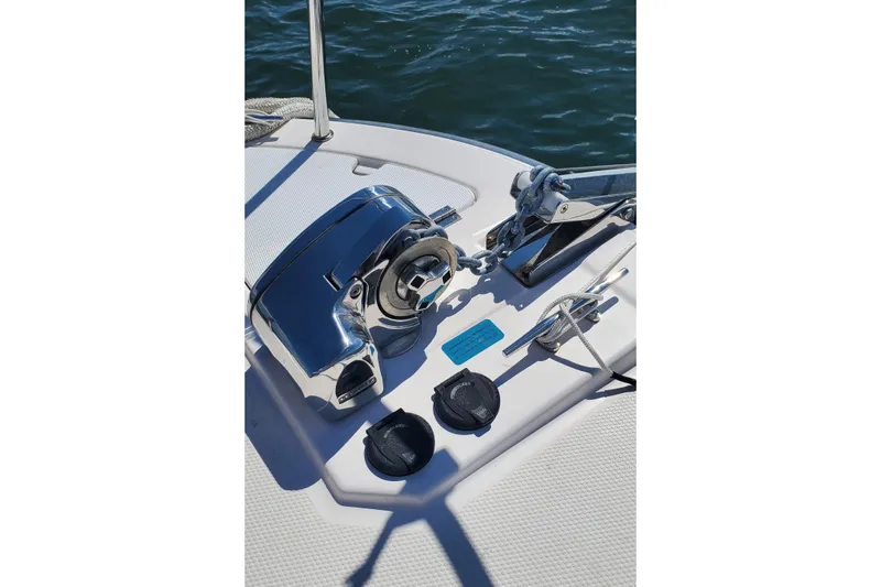 Tusen Takk Yacht Photos Pics 2024 Ranger Tugs R-27 boat deck with anchor winch and rope cleat.