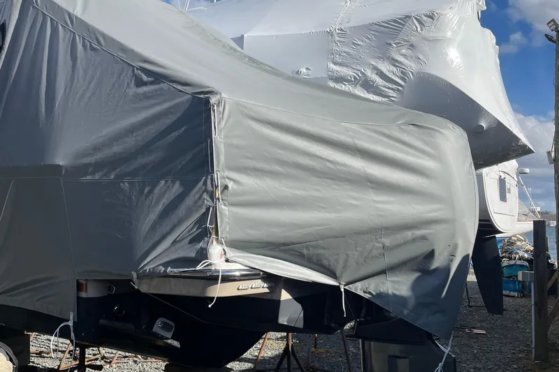 Tusen Takk Yacht Photos Pics 2024 Ranger Tugs R-27 boat covered in protective tarp at a marina.