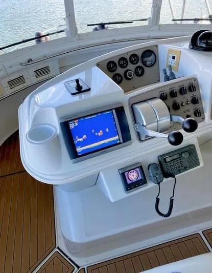  Yacht Photos Pics Helm of 1999 Carver 456 Aft Cabin Motor Yacht with navigation controls and display.