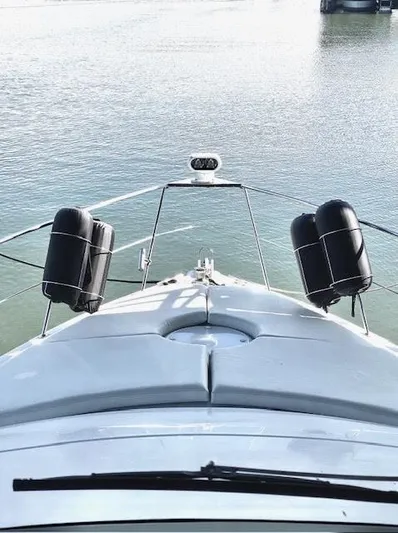  Yacht Photos Pics 1999 Carver 456 Aft Cabin Motor Yacht bow view on calm water.