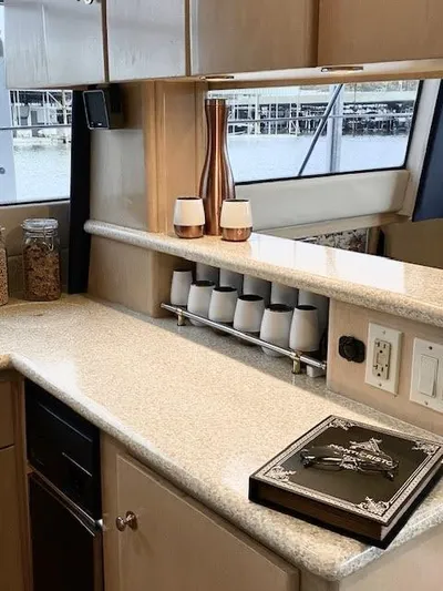  Yacht Photos Pics 1999 Carver 456 Aft Cabin Motor Yacht interior with modern kitchen and elegant decor.