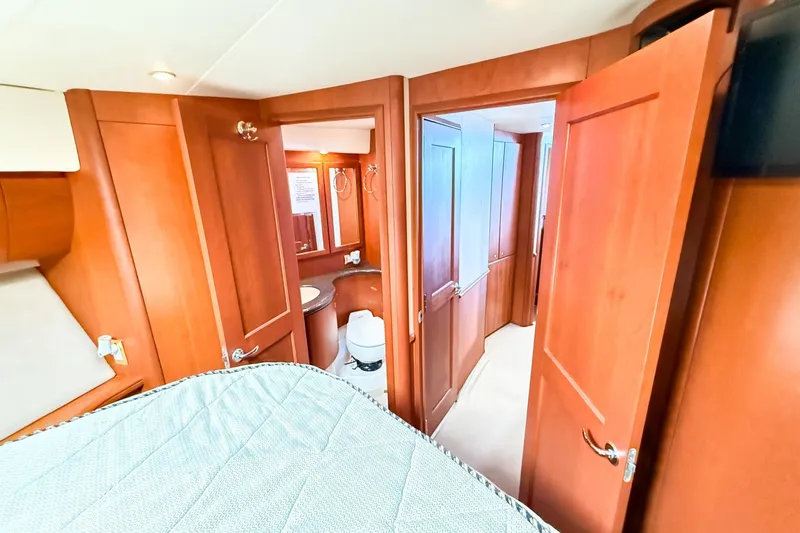 Steel Dreamin Yacht Photos Pics Interior of 2004 Silverton 48 Convertible yacht with wooden doors and cozy cabin.