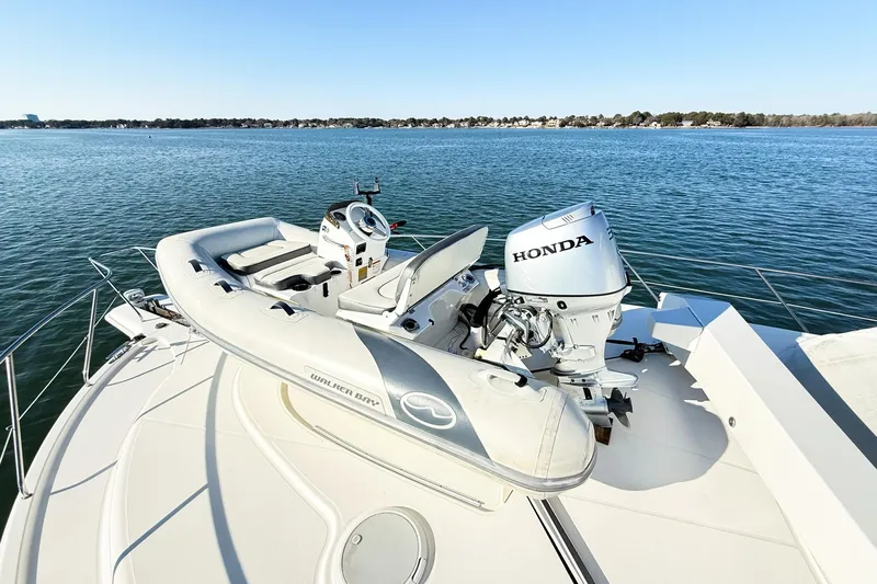 Steel Dreamin Yacht Photos Pics 2004 Silverton 48 Convertible yacht with Walker Bay tender and Honda outboard motor.