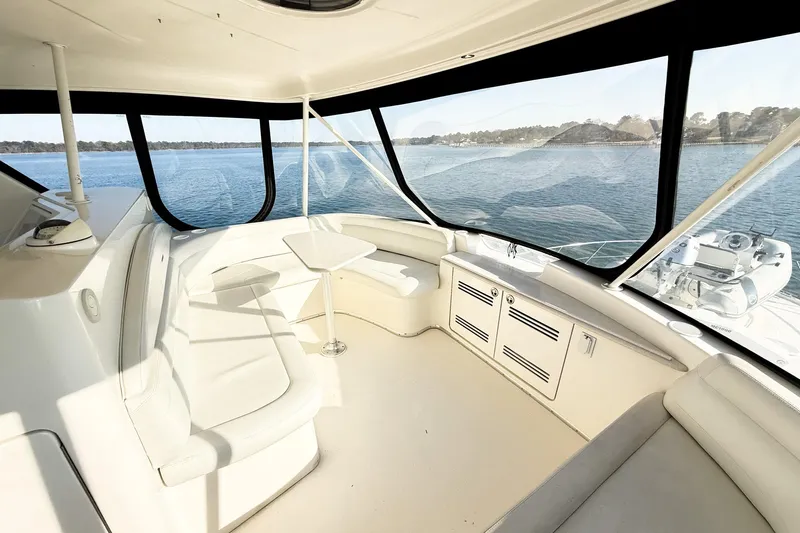 Steel Dreamin Yacht Photos Pics Interior of 2004 Silverton 48 Convertible yacht with panoramic windows and seating area.