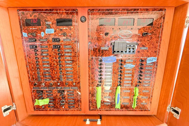 Steel Dreamin Yacht Photos Pics Electrical panel of a 2004 Silverton 48 Convertible yacht with labeled switches and meters.