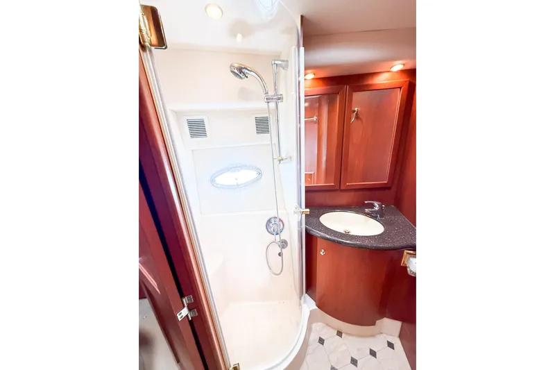 Steel Dreamin Yacht Photos Pics Luxurious bathroom in 2004 Silverton 48 Convertible yacht with shower and vanity.