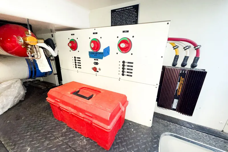 Steel Dreamin Yacht Photos Pics Engine room of 2004 Silverton 48 Convertible with control panel and red toolbox.