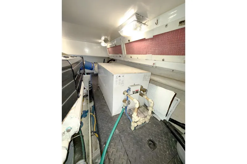 Steel Dreamin Yacht Photos Pics 2004 Silverton 48 Convertible engine room with equipment and piping.