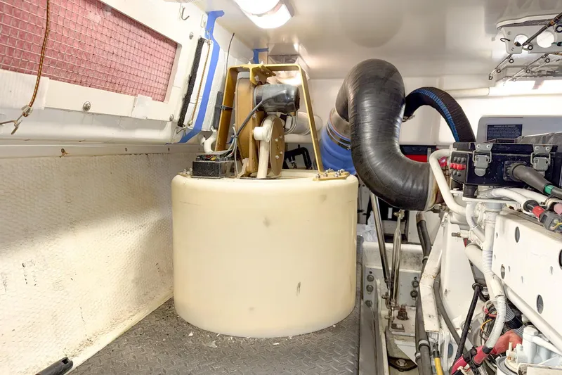 Steel Dreamin Yacht Photos Pics Engine room of a 2004 Silverton 48 Convertible yacht, featuring mechanical components.