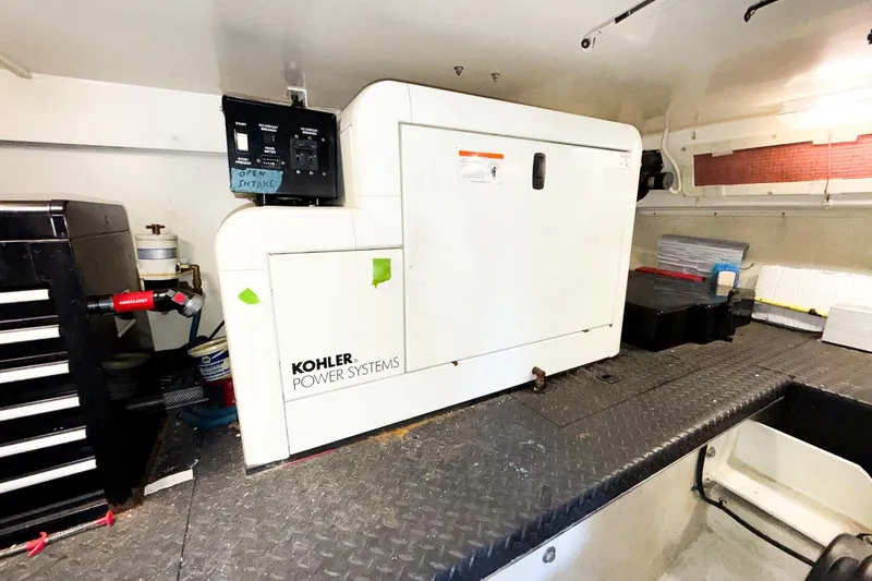 Steel Dreamin Yacht Photos Pics Engine room of 2004 Silverton 48 Convertible with Kohler power system generator.