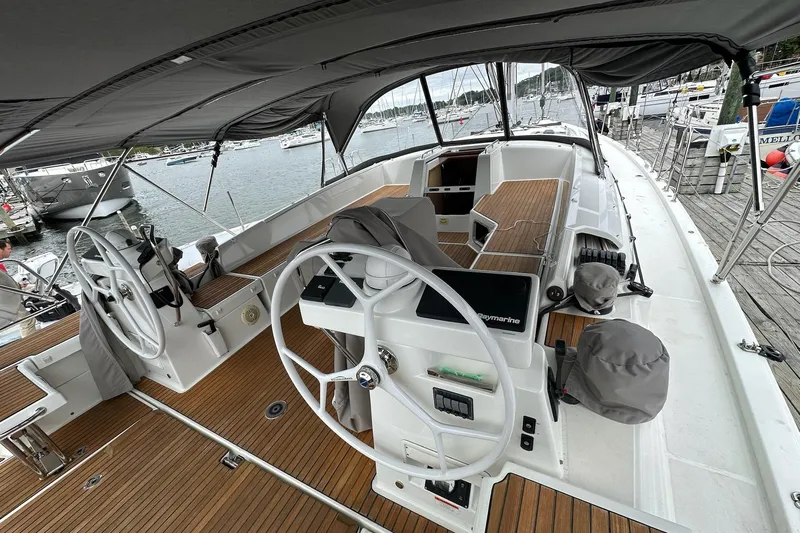  Yacht Photos Pics 2020 Jeanneau 54 yacht cockpit with dual steering wheels and teak decking.