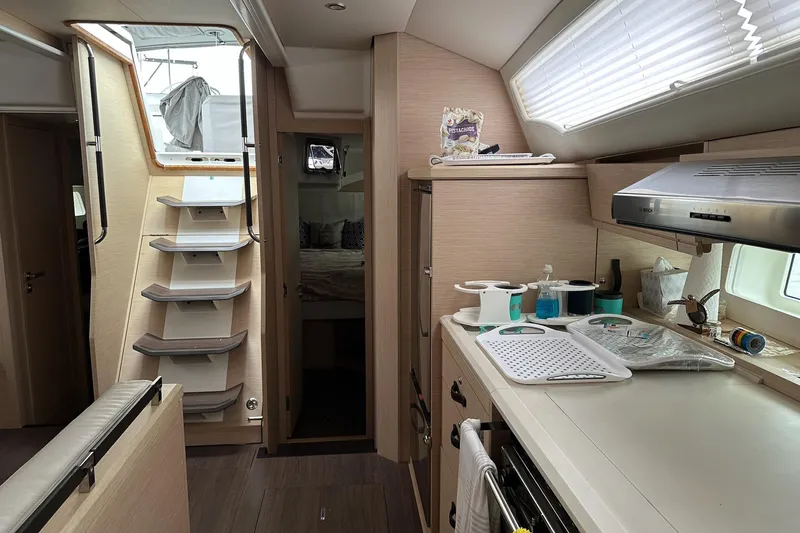  Yacht Photos Pics Interior of 2020 Jeanneau 54 yacht featuring modern kitchen and cozy cabin.