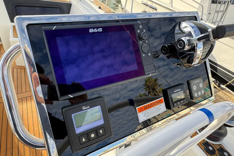  Yacht Photos Pics Control panel of 2023 Beneteau Oceanis 46.1 yacht with navigation and monitoring systems.