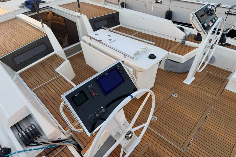  Yacht Photos Pics 2023 Beneteau Oceanis 46.1 yacht cockpit with dual steering wheels and teak decking.