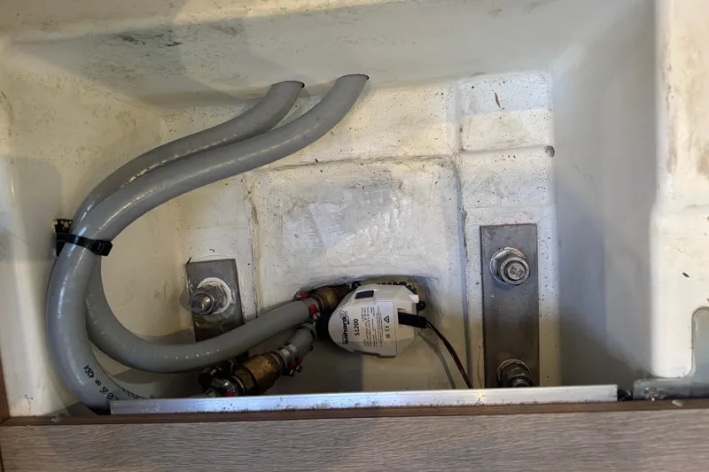  Yacht Photos Pics Bilge area of 2023 Beneteau Oceanis 46.1 with hoses and pump system.