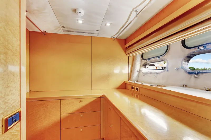  Yacht Photos Pics Luxurious interior of 2007 Sunseeker Predator 108 yacht with sleek wood finish and porthole windows.