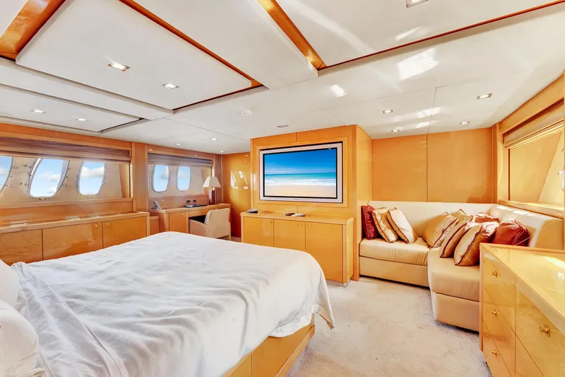  Yacht Photos Pics Luxurious bedroom interior of 2007 Sunseeker Predator 108 yacht with elegant furnishings and large windows.