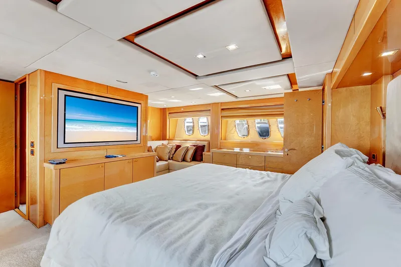  Yacht Photos Pics Luxurious bedroom interior of 2007 Sunseeker Predator 108 yacht with modern decor and large TV.