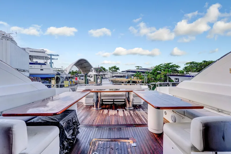  Yacht Photos Pics Luxurious 2007 Sunseeker Predator 108 yacht deck with elegant seating and wooden flooring.