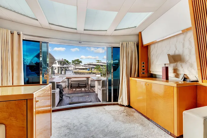  Yacht Photos Pics Luxurious interior of 2007 Sunseeker Predator 108 yacht with elegant wood finishes and marina view.