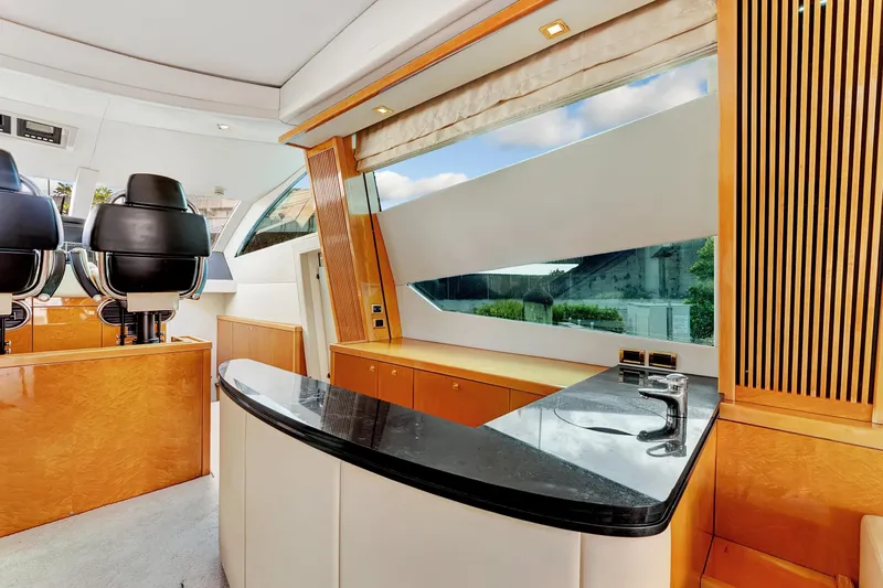  Yacht Photos Pics Luxurious interior of 2007 Sunseeker Predator 108 yacht with sleek design and modern amenities.