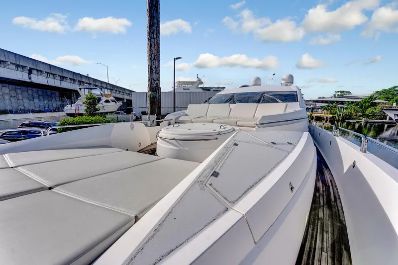  Yacht Photos Pics 2007 Sunseeker Predator 108 yacht with sleek design and spacious deck, docked near marina.