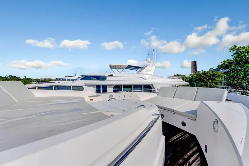  Yacht Photos Pics 2007 Sunseeker Predator 108 yacht with sleek design and spacious deck under blue sky.