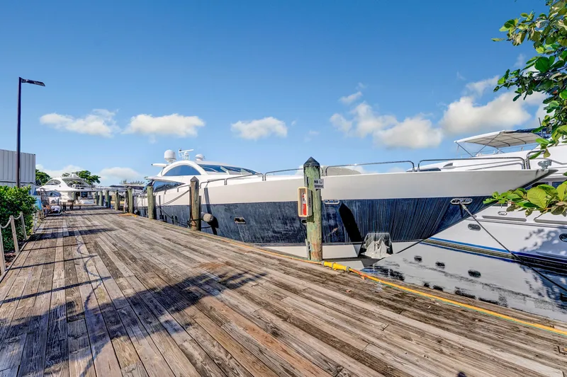  Yacht Photos Pics 2007 Sunseeker Predator 108 yacht docked at a sunny marina with clear skies.