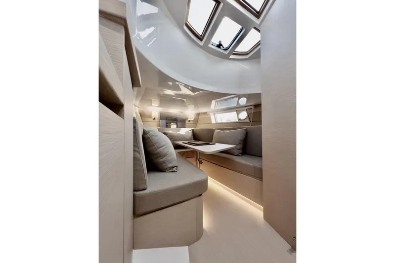 Oasis Yacht Photos Pics Luxurious interior of 2022 Tesoro T40 Inboard yacht with modern seating and skylights.