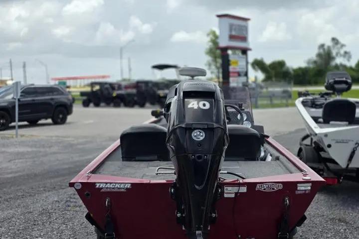 2020 Tracker Pro 160 boat with 40 HP motor in a parking lot.