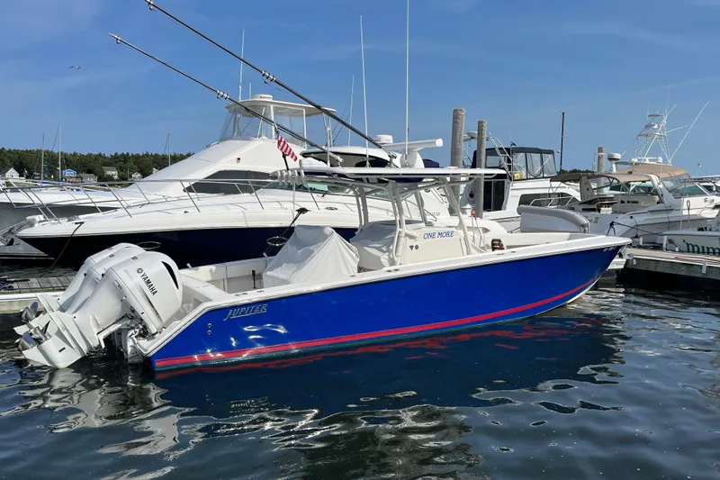  Yacht Photos Pics 2020 Jupiter 34 Center Console boat docked, featuring a sleek blue hull and Yamaha engines.