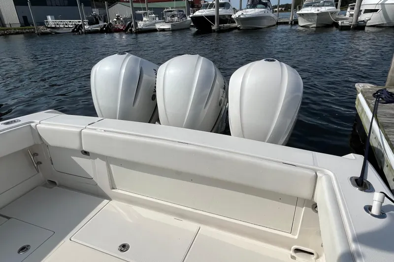  Yacht Photos Pics 2020 Jupiter 34 Center Console with triple outboard engines docked at marina.