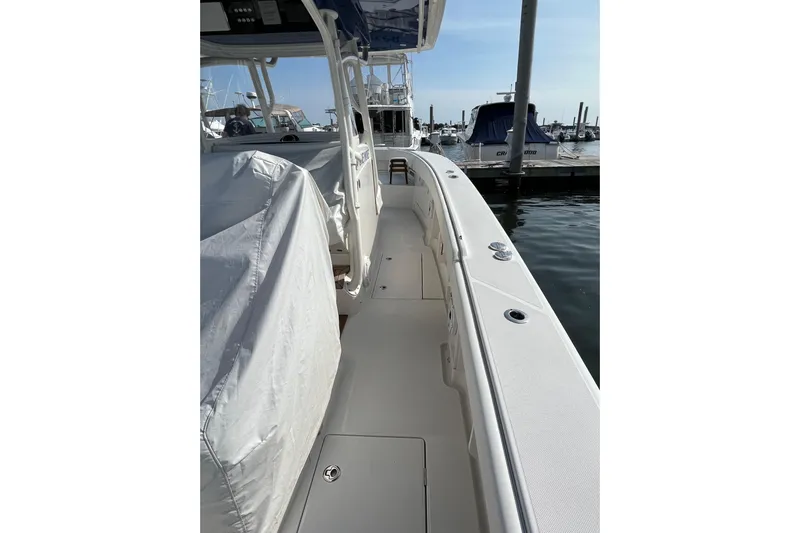  Yacht Photos Pics 2020 Jupiter 34 Center Console boat docked at marina, side view.