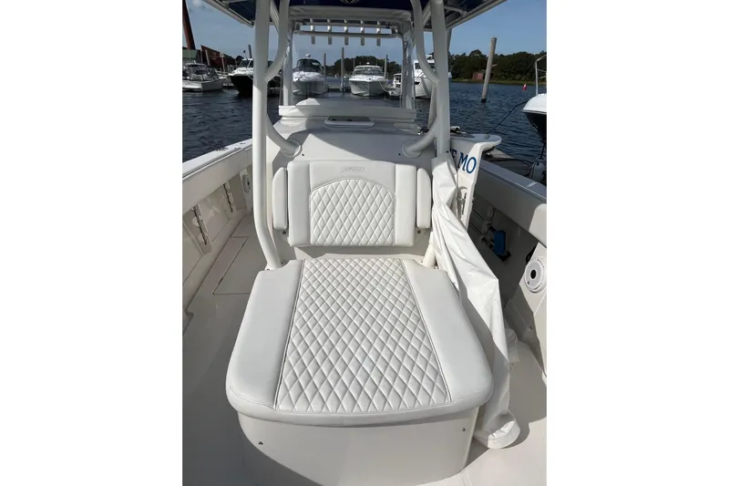  Yacht Photos Pics 2020 Jupiter 34 Center Console boat with white quilted seating, docked at marina.