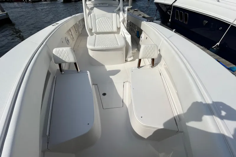  Yacht Photos Pics 2020 Jupiter 34 Center Console boat interior with white seating and storage compartments.