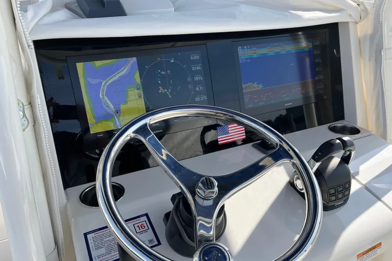  Yacht Photos Pics Steering console of 2020 Jupiter 34 Center Console with navigation screens and controls.