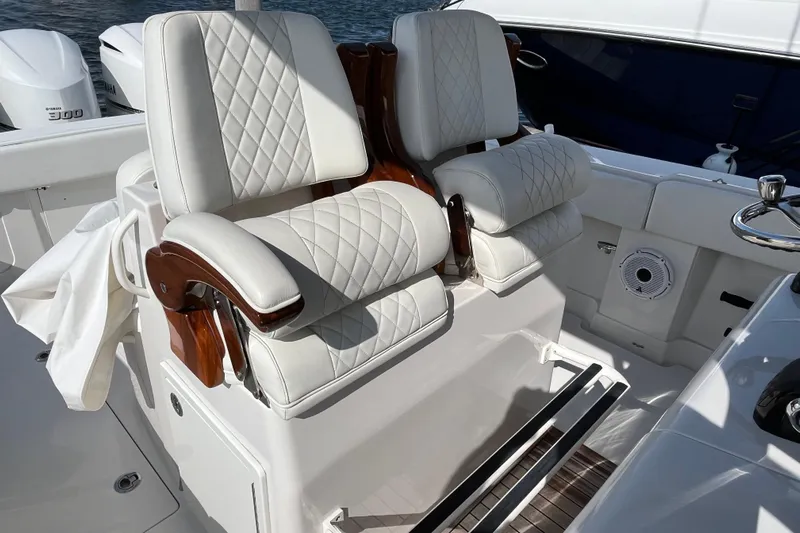  Yacht Photos Pics Luxurious seating on 2020 Jupiter 34 Center Console boat with white quilted upholstery.