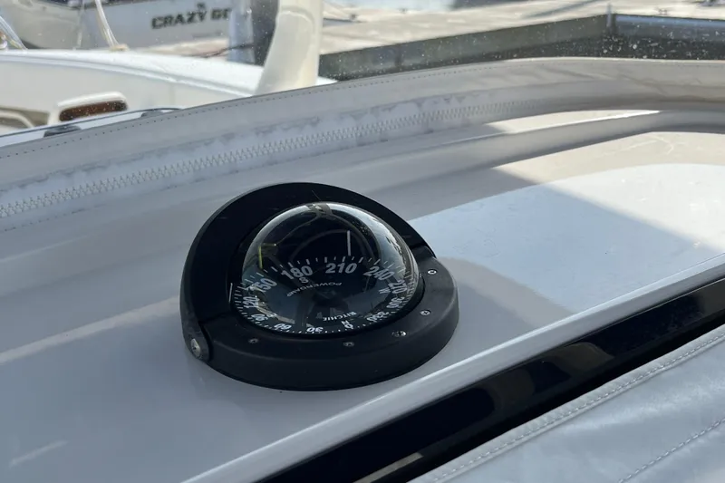 Yacht Photos Pics Compass on 2020 Jupiter 34 Center Console boat dashboard, docked in marina.