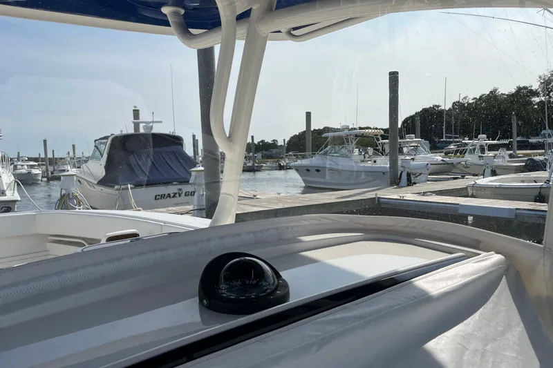  Yacht Photos Pics 2020 Jupiter 34 Center Console at marina, surrounded by boats.