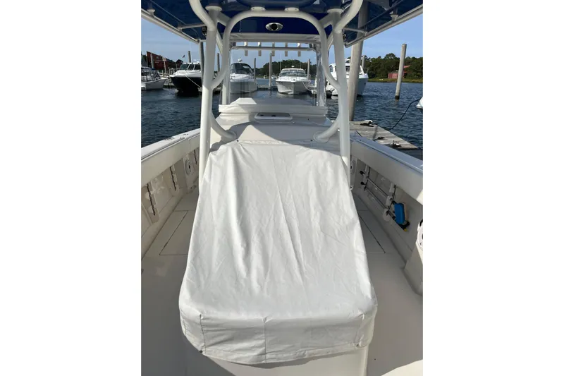  Yacht Photos Pics 2020 Jupiter 34 Center Console boat docked, featuring covered seating and sleek design.
