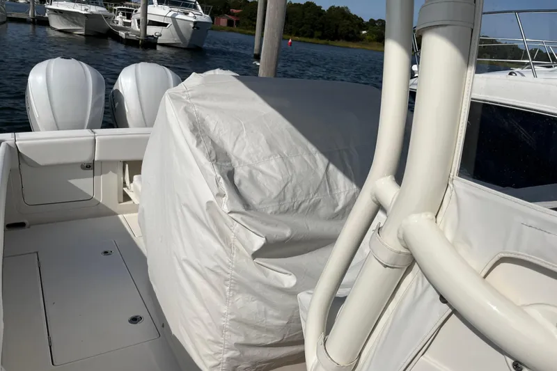  Yacht Photos Pics 2020 Jupiter 34 Center Console boat with covered seating and twin engines docked.