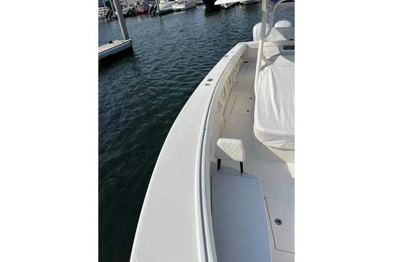  Yacht Photos Pics 2020 Jupiter 34 Center Console boat docked, showcasing sleek design and spacious deck.