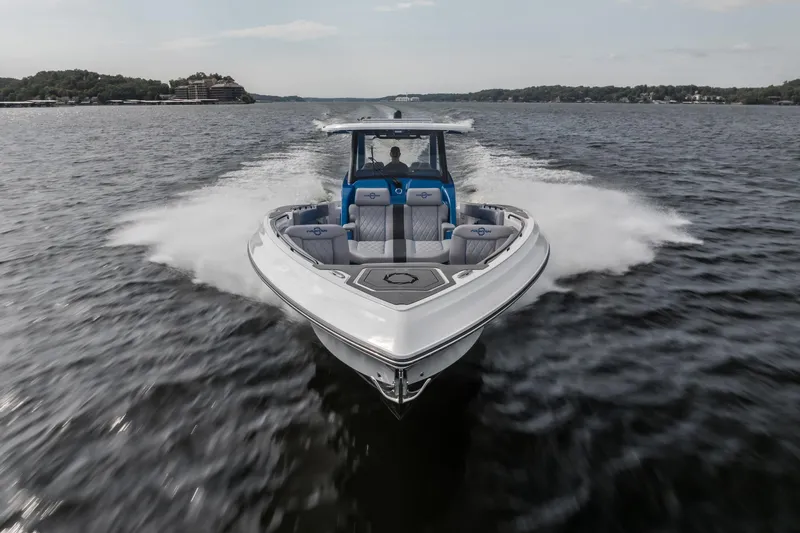  Yacht Photos Pics 2026 Fountain 43 SCX speedboat cruising on open water, showcasing sleek design and performance.