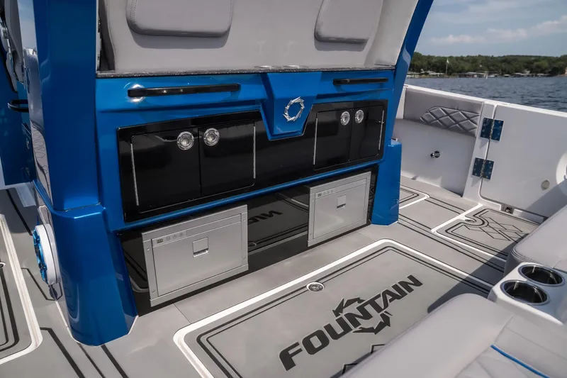  Yacht Photos Pics 2026 Fountain 43 SCX boat interior with sleek blue cabinetry and modern design.