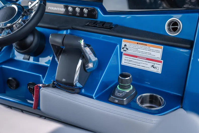  Yacht Photos Pics 2026 Fountain 43 SCX boat dashboard with steering wheel and control panel.