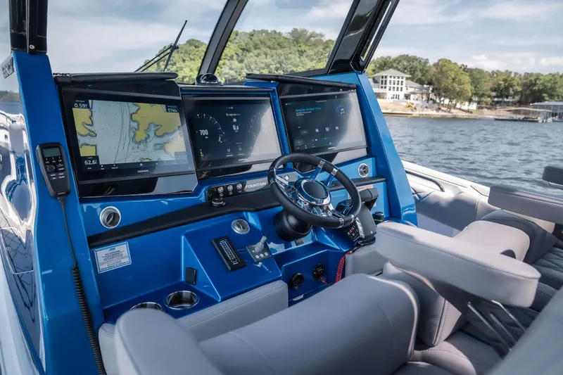  Yacht Photos Pics 2026 Fountain 43 SCX boat cockpit with advanced navigation displays and steering wheel.