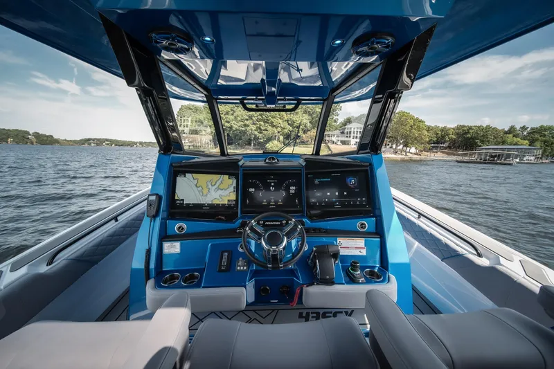  Yacht Photos Pics Cockpit view of 2026 Fountain 43 SCX boat with advanced navigation systems.