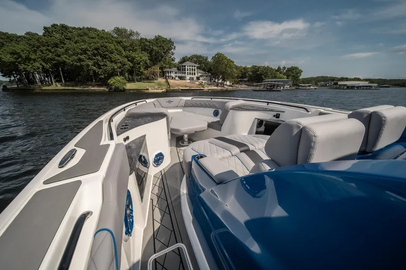  Yacht Photos Pics 2026 Fountain 43 SCX boat interior with luxurious seating on a scenic lake.