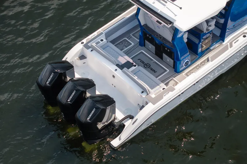  Yacht Photos Pics 2026 Fountain 43 SCX boat with triple outboard engines on water.